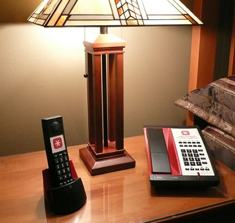 Hotel bedside table with Tel-Phone Resources phones